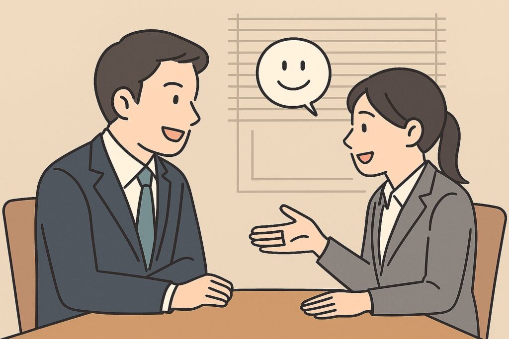 オフィスで向き合って話し合う上司と部下のイラスト。穏やかに対話する様子が描かれている